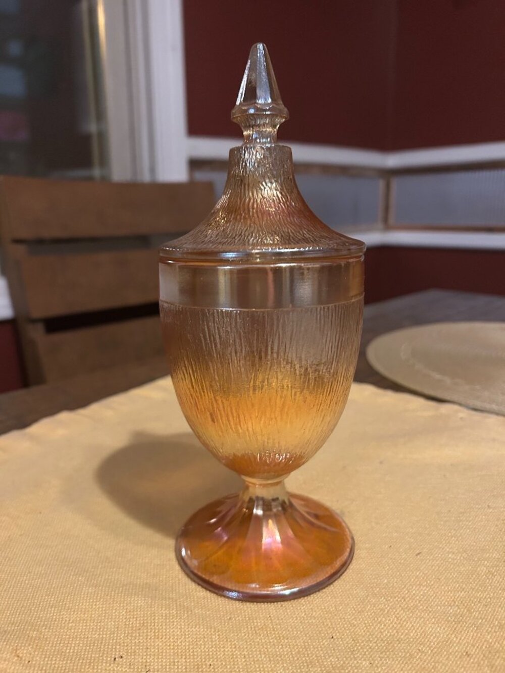 Vintage Marigold Carnival glass pedestal candy jar features a shimmering irid